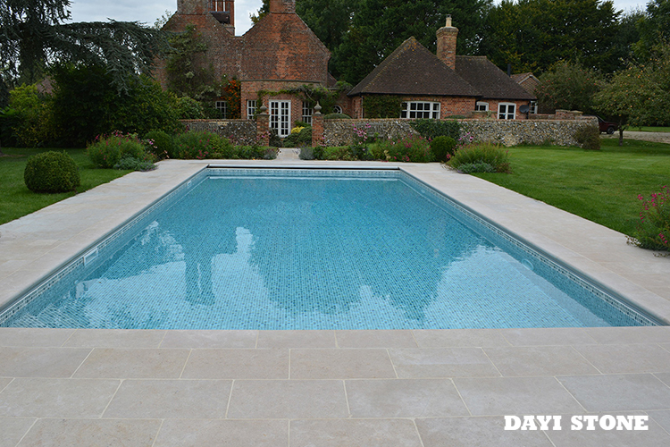 Natural Stone Outdoor Swimming Pool With Stone Curve Border Stock
